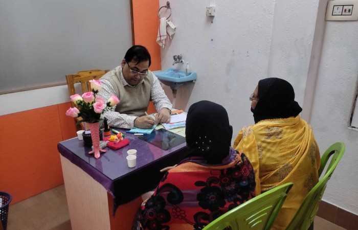 Dr. Abhijit Bhaumik with his patients in his clinic.